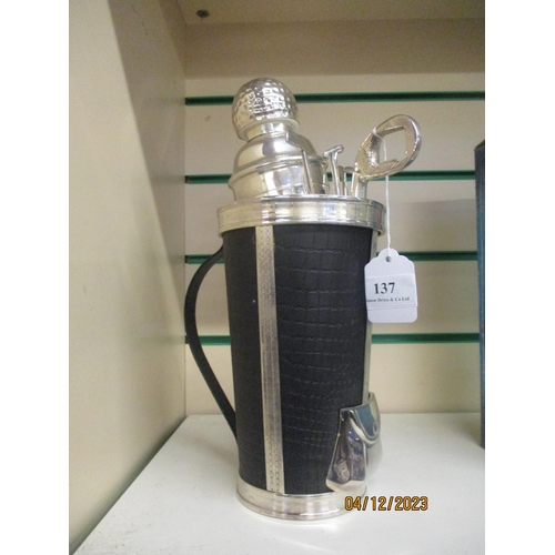 137 - A novelty silver plated cocktail shaker modelled in the form of a golf bag, clubs and accessories