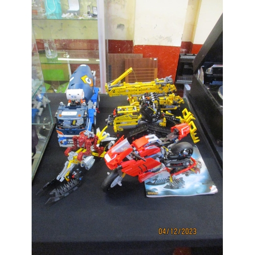 274 - A group of Lego Technics vehicles and motor cycles