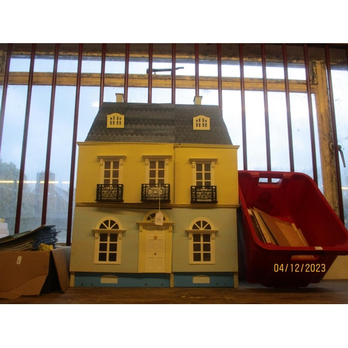 312 - A dolls house modelled in the Georgian style together with several furnishing kits