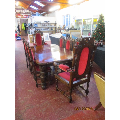 325 - A late Victorian oak extending dining table with profuse carved decoration together with two carvers... 