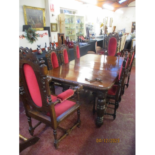 325 - A late Victorian oak extending dining table with profuse carved decoration together with two carvers... 