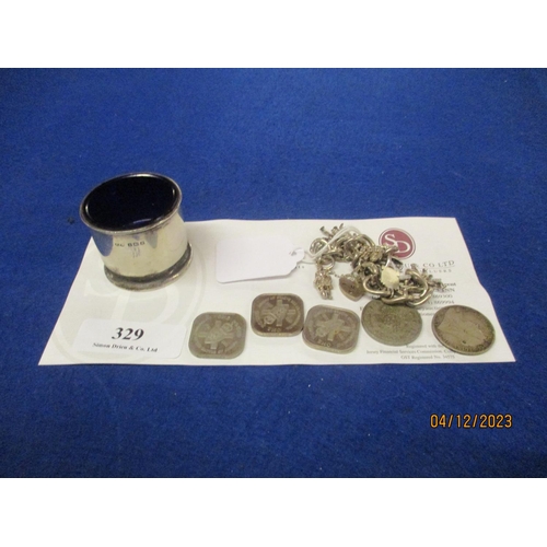 329 - A silver salt with original Bristol blue glass liner, a silver charm bracelet and assorted coinage