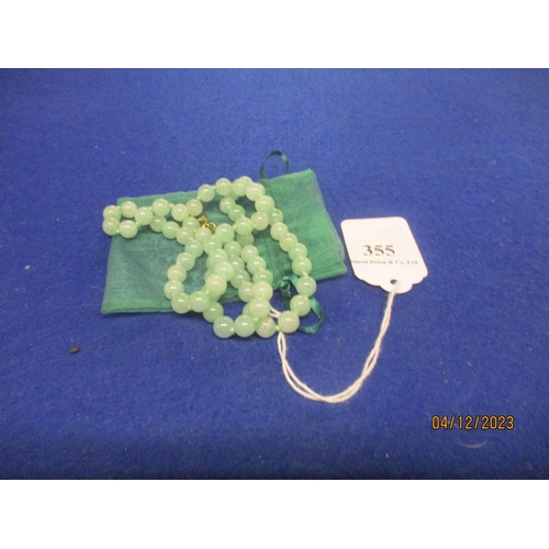 355 - A vintage Jade silk knotted necklace