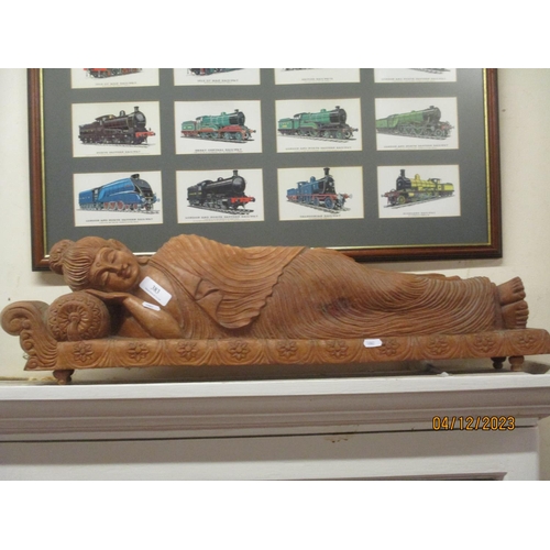 383 - A large hard wood carving of a reclined oriental woman