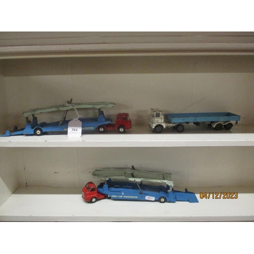 384 - Two mid century Corgi diecast models of Bedford articulated car transporters together with a similar... 