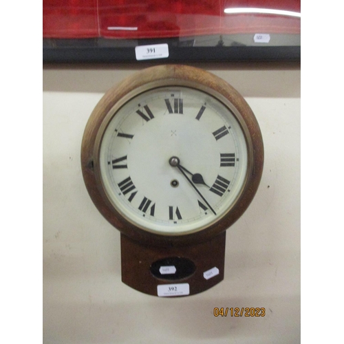 392 - A vintage oak cased wall clock