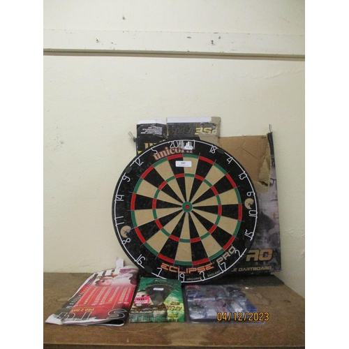 397 - A Unicorn Eclipse Pro dart board together with various darts, flights etc.