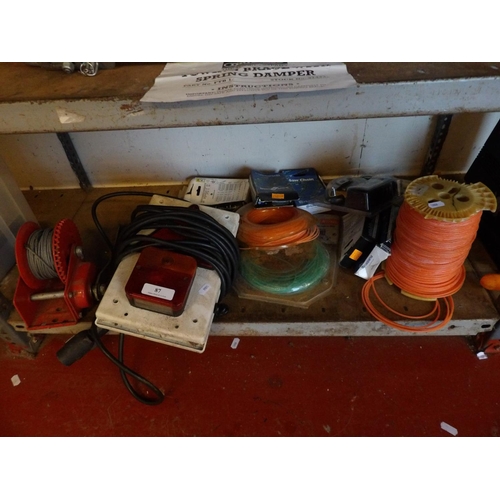 87 - A trailer lighting set, a trailer winch, a metering wheel, a 12 volt air compressor, strimmer and ga... 