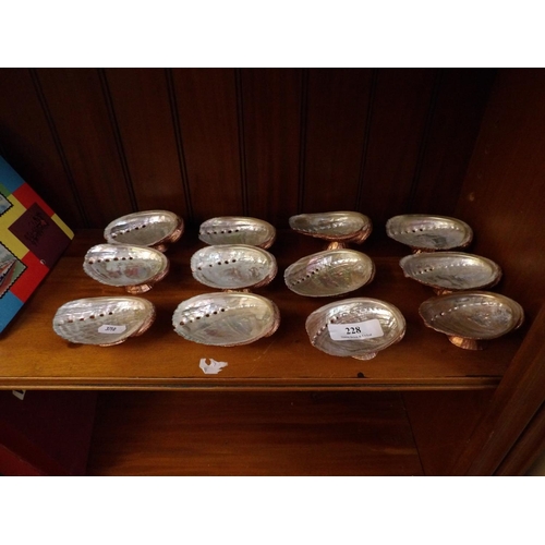 228 - A set of twelve bronze gilt ormer shell dishes