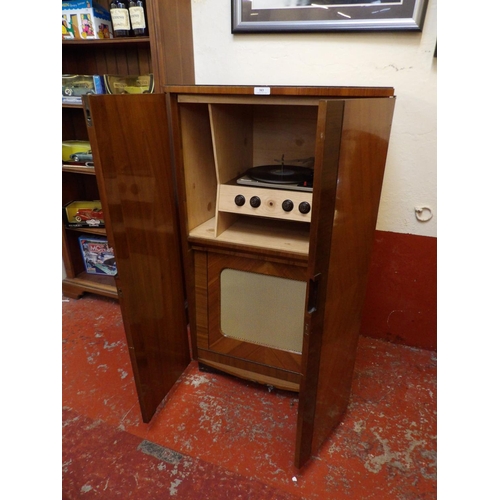 383 - A mid century burr walnut cabinet record player by Messrs. Garrard