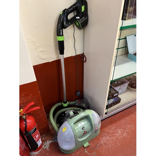 104 - A Bissell Little Green vacuum cleaner together with a Gtech cordless sweeper