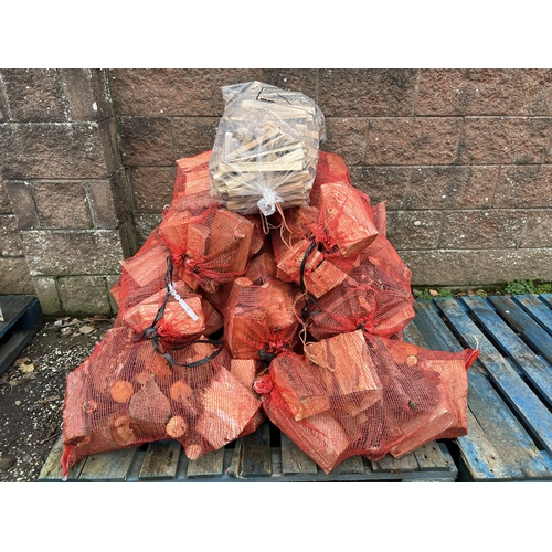 24 - Ten bags of logs together with a bag of kindling wood