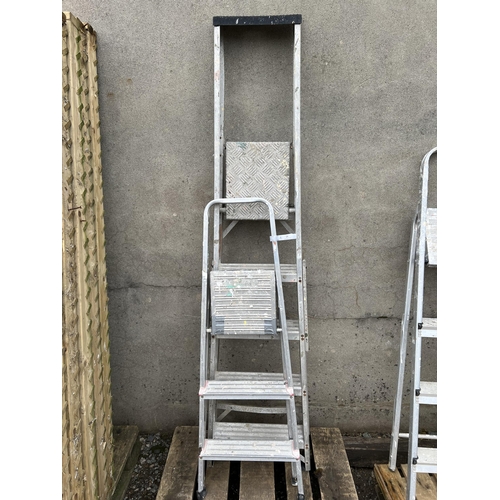 29 - An aluminium five tread stepladder together with an aluminium three tread stepladder