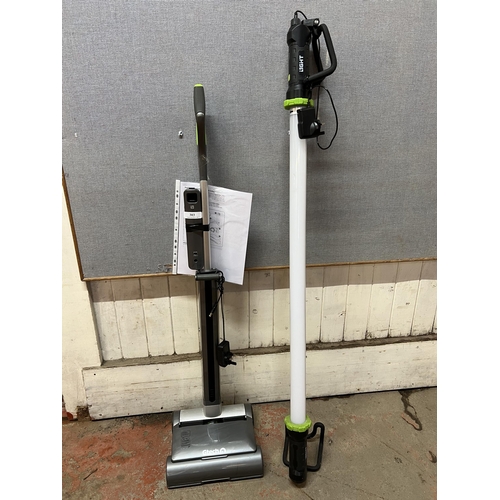 303 - A Gtech cordless sweeper together with a Gtech cordless strip light