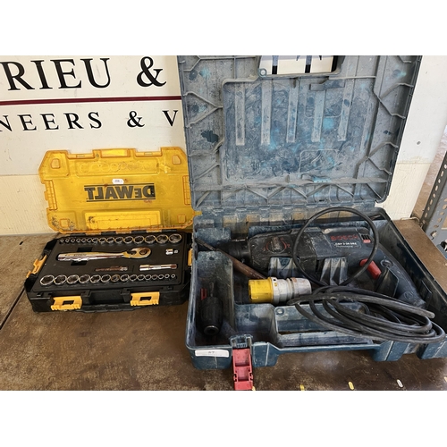 57 - A Bosch 110 volt rotary hammer drill together with a DeWalt 3/8