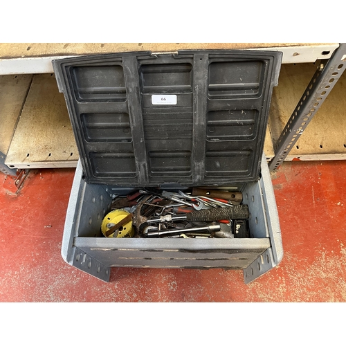 66 - A toolbox containing an assortment of tools