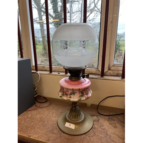 69 - A Victorian paraffin oil lamp fitted a later shade