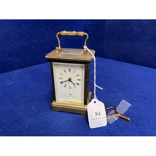 84 - A brass cased carriage clock by Messrs. Matthew Norman