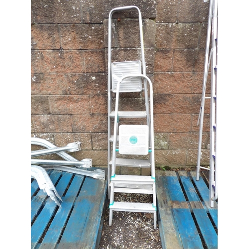 24 - An aluminium five tread step ladder together with an aluminium three tread step ladder