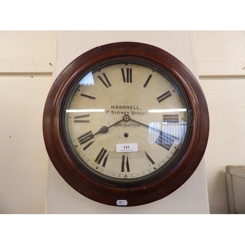 141 - A vintage mahogany cased wall clock inscribed H. Sorrell, 1A Sydney Street, Brighton