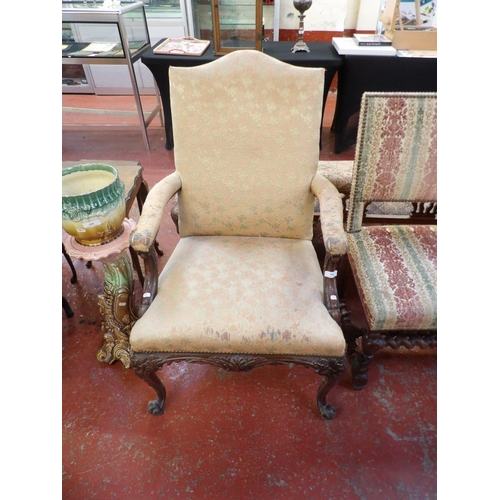 194 - A vintage mahogany open armchair