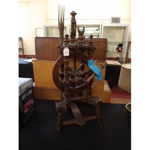 197 - A vintage oak spinning wheel