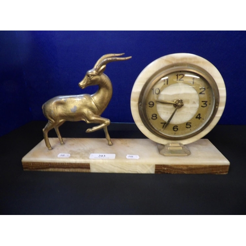 203 - An Art Deco marble mantle clock with gilded antelope decoration