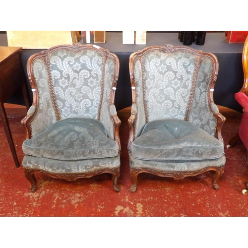 229 - A pair of vintage bergère armchairs upholstered in blue coloured flock design fabric