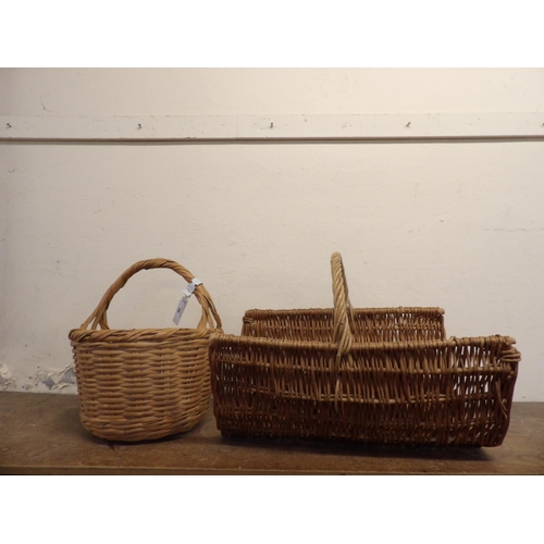 300 - A wicker log basket together with another wicker basket