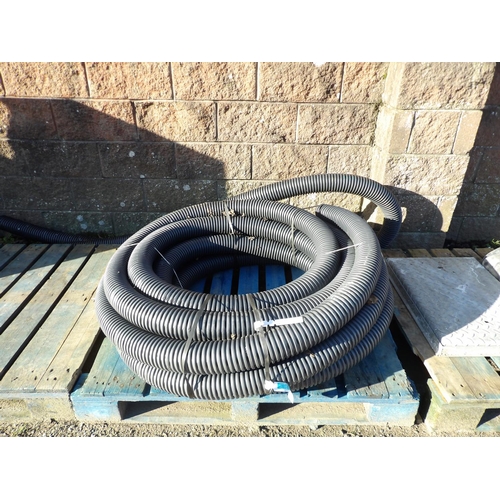 17 - A coil of Naylor 100mm land drainage pipe