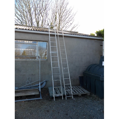 23 - An aluminium fourteen tread roof ladder together with an aluminium eighteen tread ladder