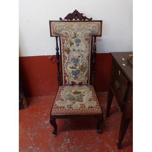 144 - A nineteenth century rosewood prayer chair upholstered in tapestry fabric