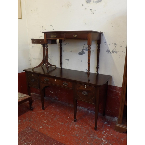 145 - A nineteenth century mahogany sideboard, an Edwardian writing table and a mahogany single pedestal l... 