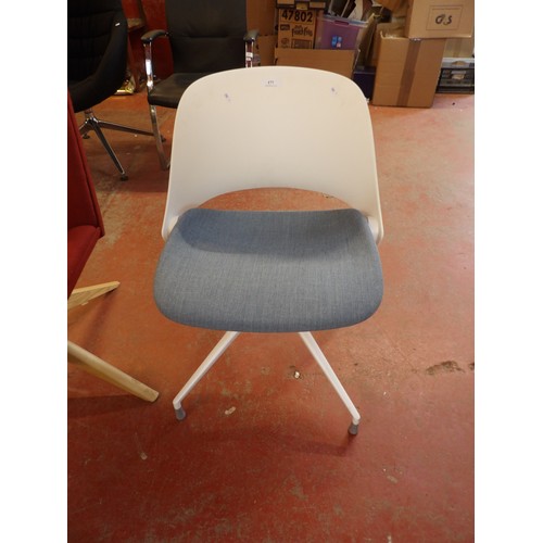 177 - A revolving office chair upholstered in blue fabric in the Modernist style