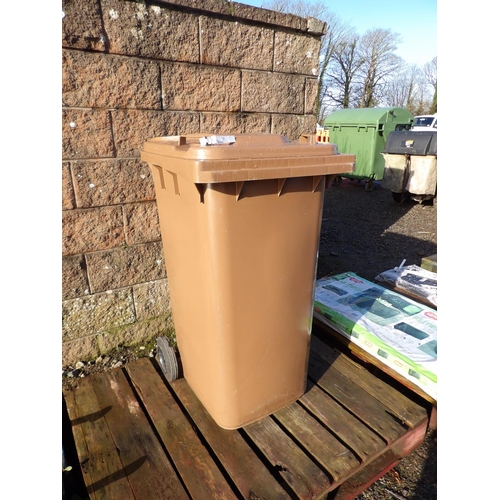 21 - A brown PVC wheelie bin