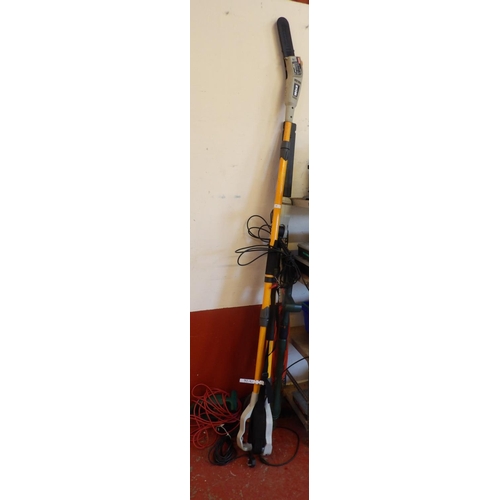 65 - A Ryobi electric long reach chainsaw pole pruner together with a similar hedge cutter, an electric s... 