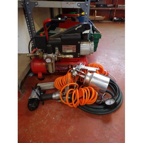 77 - A Sealey 6L capacity portable compressor together with associated tools and hoses