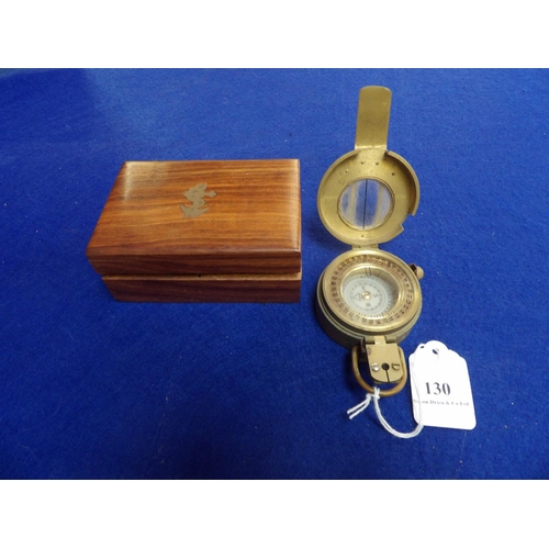 130 - A brass cased compass encased within a mahogany box modelled in the Victorian style