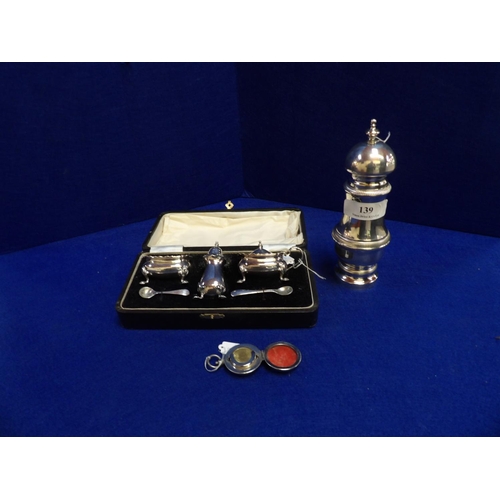 139 - A boxed silver plated condiment set, a large caster and a sovereign holder