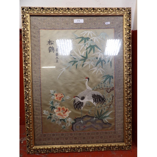 174 - A gilt framed oriental silk embroidery