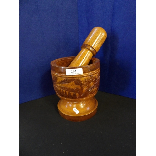 202 - A treen mortar and pestle of enormous proportion