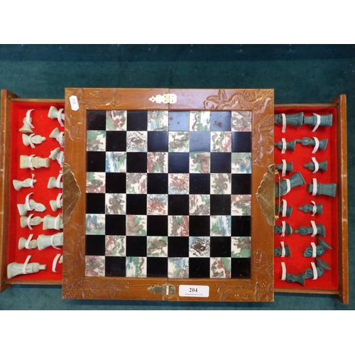 204 - A portable folding chess set modelled in the oriental style