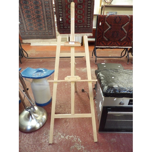 210 - A pine floor standing picture easel