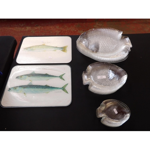 222 - A glass fish eating set together with two glass chopping boards featuring Mackerel and Salmon