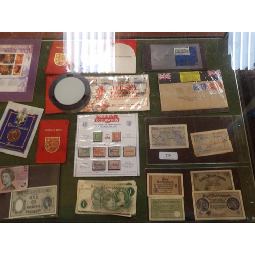 229 - Assorted vintage bank notes and tokens including two vintage States of Jersey one and two shilling n... 