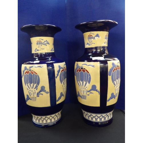 273 - A pair of large glazed ceramic vases with balloon decoration