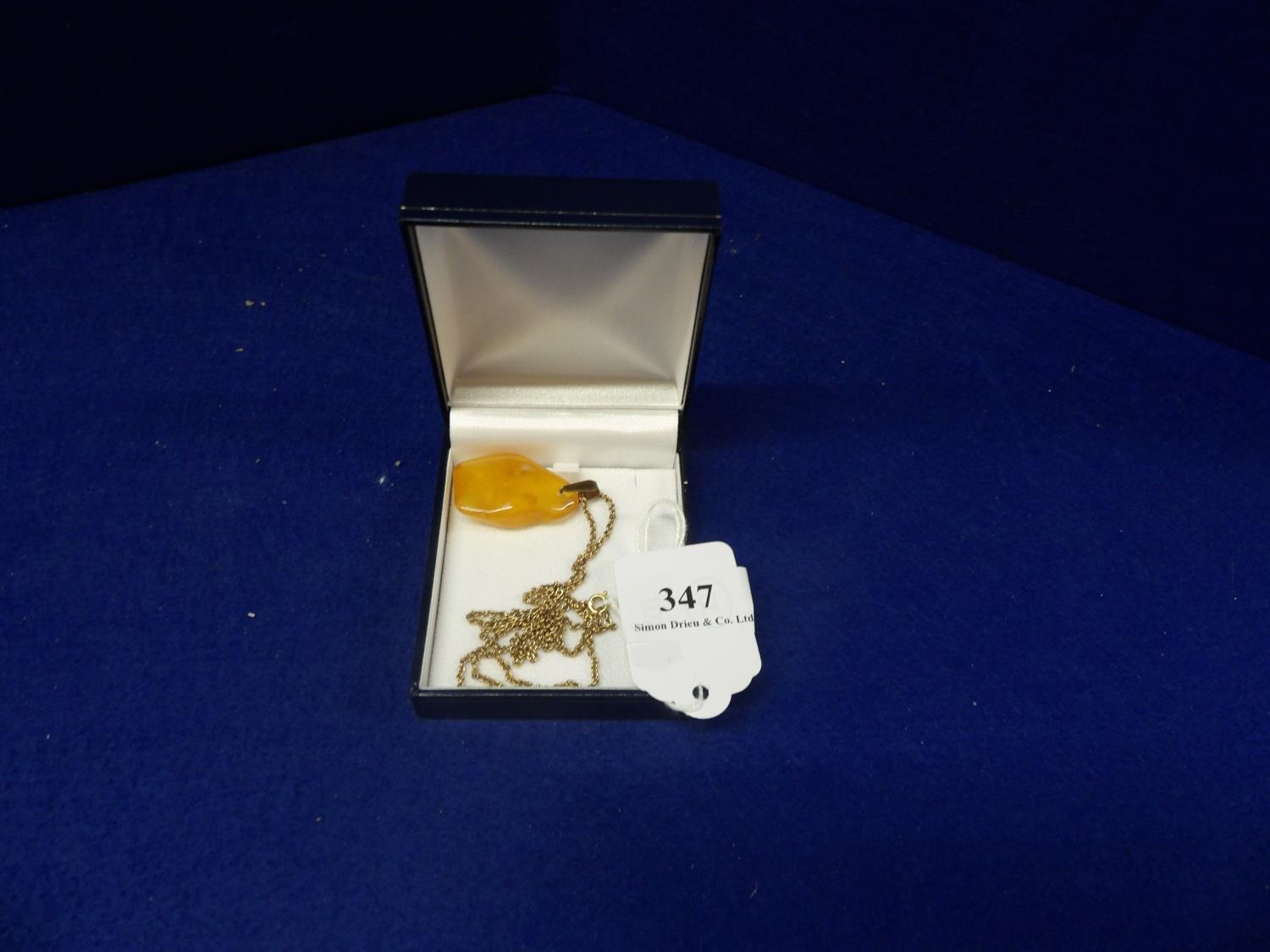 A Large Natural Butterscotch Amber Pendant   1100079219.JPG