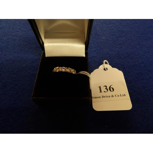 136 - A 15 carat gold ring set with five cubic zirconia