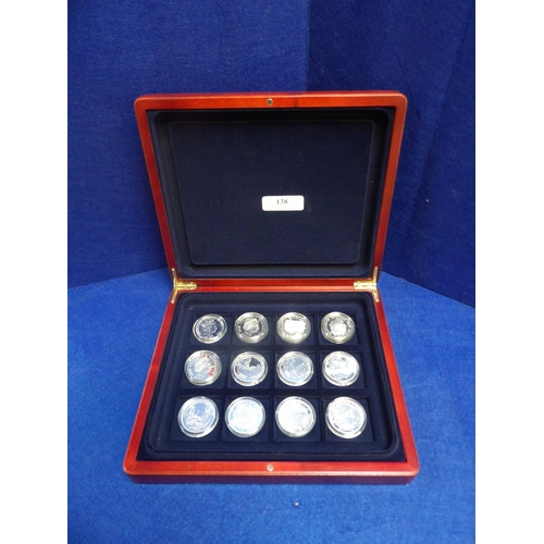 138 - A boxed collection of twelve Memories of Wartime Britain sterling silver coins complete with associa... 