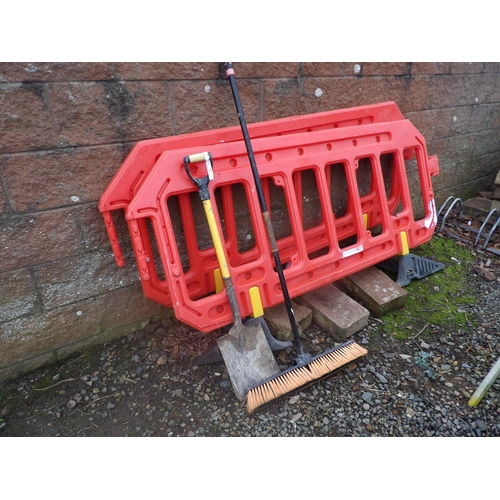 22 - Two plastic road barriers, a shovel and a brush